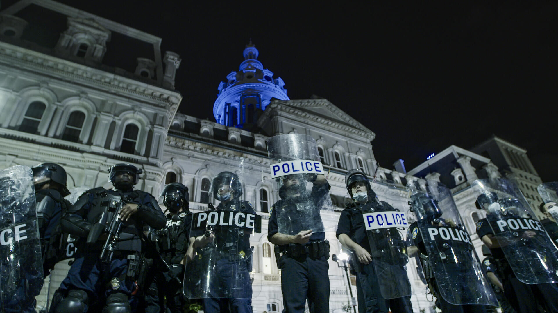 TheBodyPolitic_#3 _revised_Image of Riot Police and Baltimore City Hall_photo credit TBP_Copy